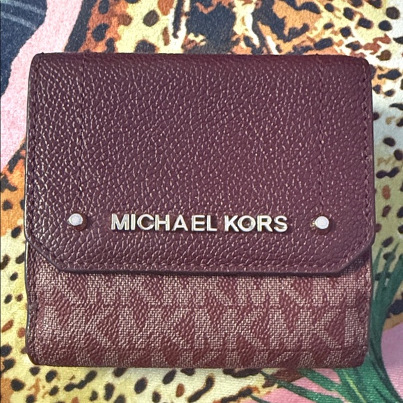 Michael Kors Handbags - Michael Kors Plum Textured Wallet
